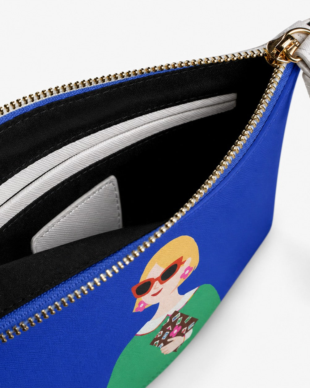 Open Lucky Tiles clutch bag showing black lining, zip closure, and interior compartment
