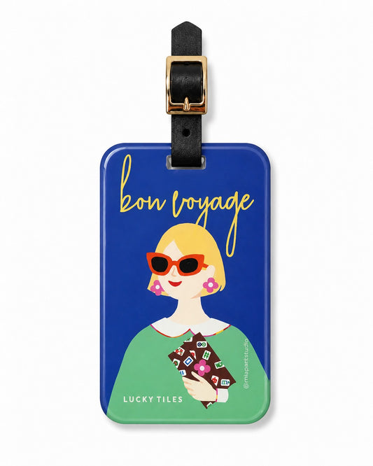 Lucky Tiles luggage tag featuring a stylish modern muse with bold sunglasses and a Mahjong-inspired clutch against a cobalt blue background