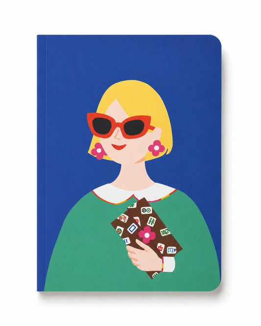 Lucky Tiles soft cover journal featuring a modern muse with bold sunglasses holding Mahjong-inspired lucky tiles on a cobalt blue background