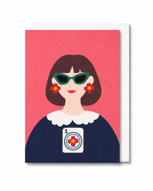 The One and Only Prime Dot greeting card featuring a stylish woman with bold sunglasses, floral earrings, and a One Dot Mahjong tile motif against a coral background