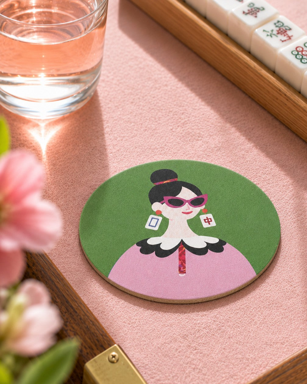 The Dragon Pair Mahjong-inspired coaster on a modern Mahjong game table with sparkling water