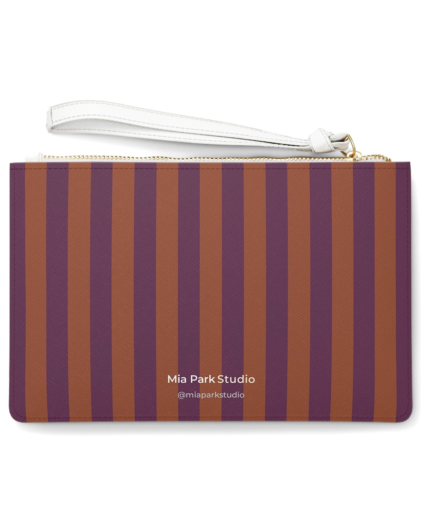 Back of Before the Game clutch bag featuring a striped pattern inspired by the muse's auburn hair and plum background