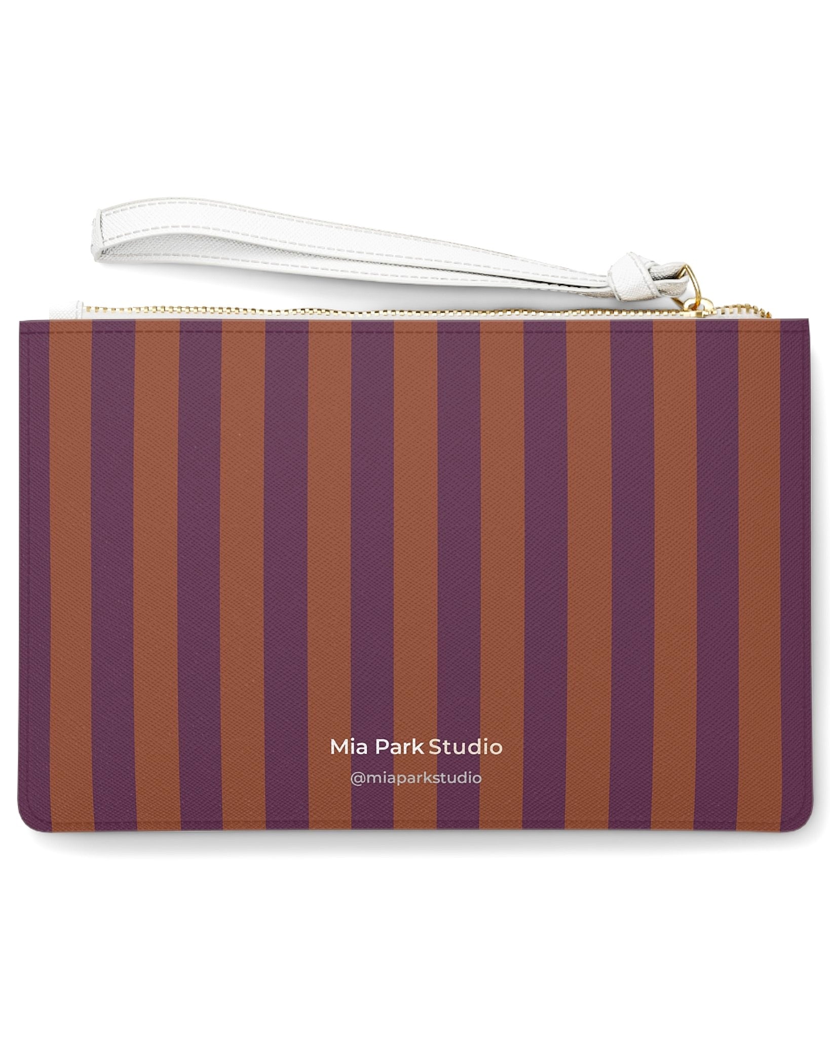 Back of Before the Game clutch bag featuring a striped pattern inspired by the muse's auburn hair and plum background